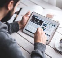 Man looking at tablet